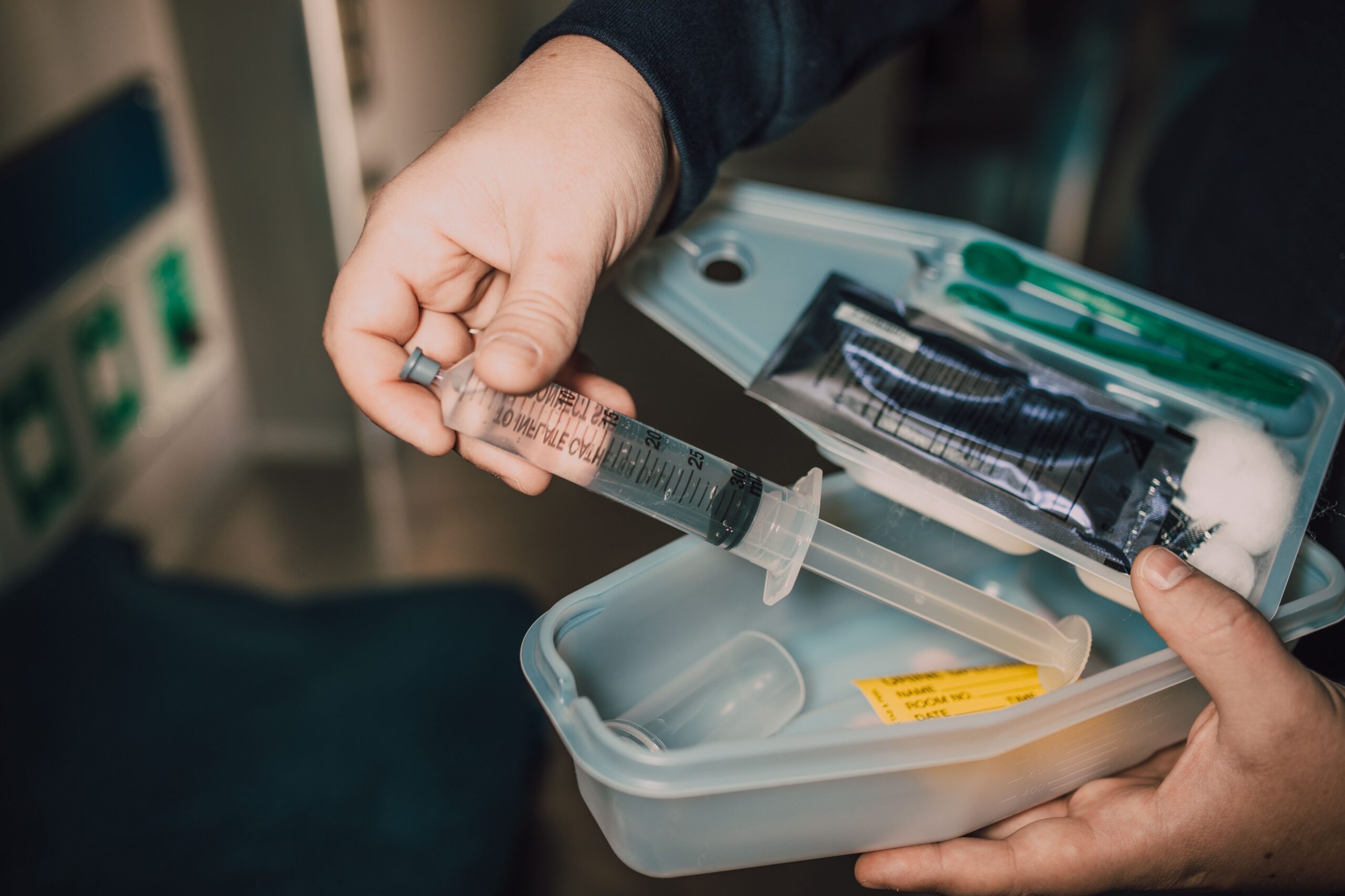 Using a pet first-aid kit to check a dog paw