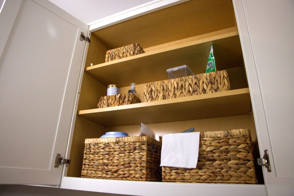 Cabinet organized with woven storage baskets