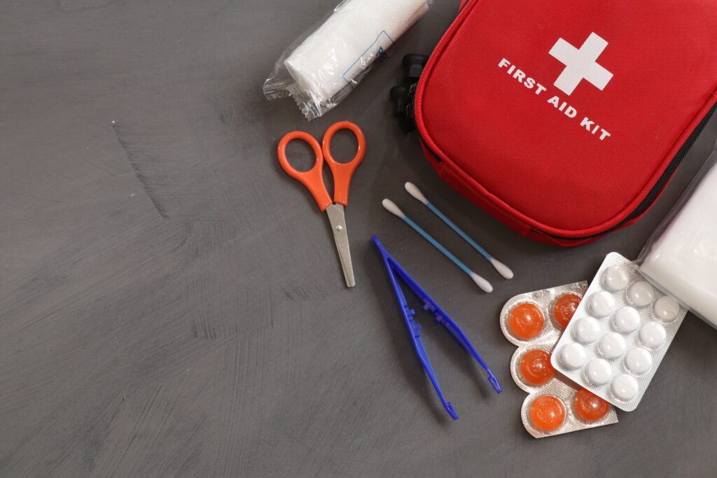 A homemade pet first-aid kit laid out on a table