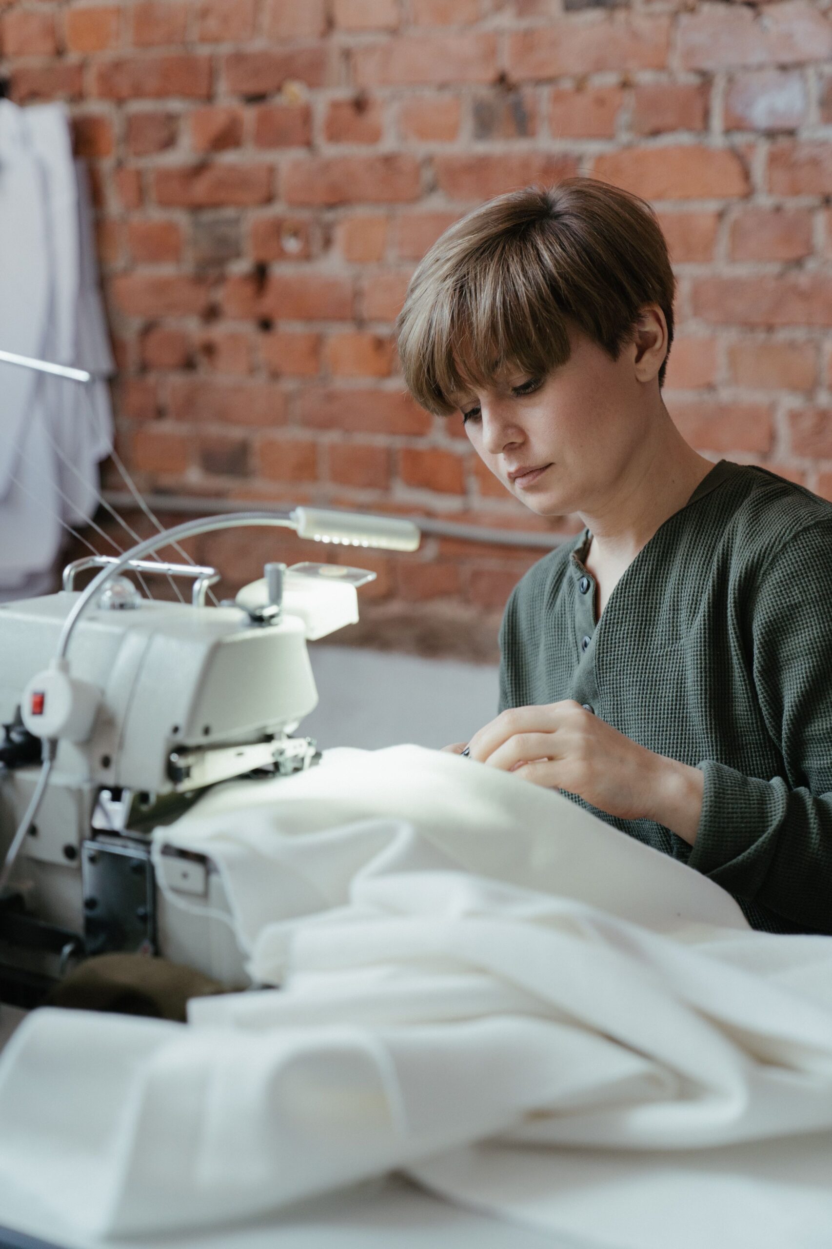 Sewing a pet food mat at a sewing machine